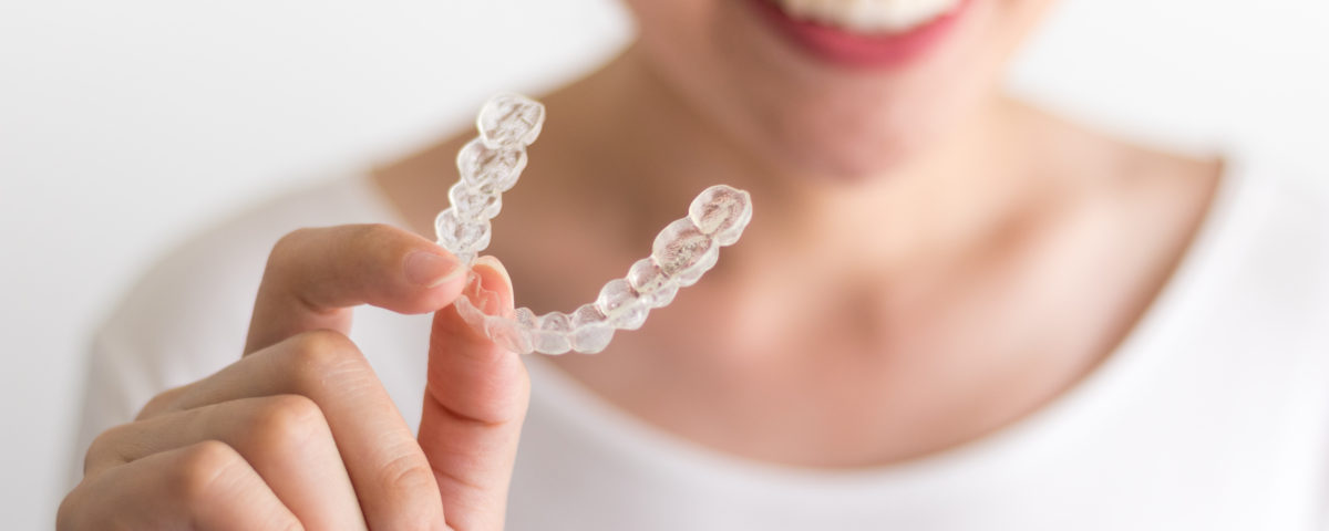 Getting Used to Your New Invisalign® Aligners - Smiles 4 Grant Park