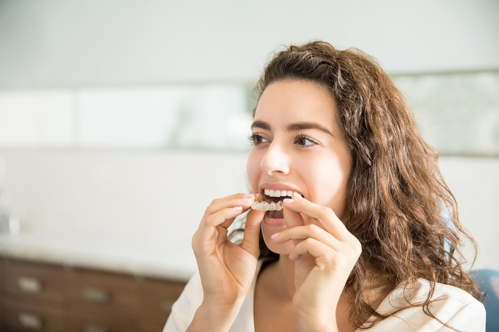 Do I Really Have to Wear Invisalign Aligner Trays 22 Hours a Day? - Smiles 4 Grant Park | Abbey Lee, DMD